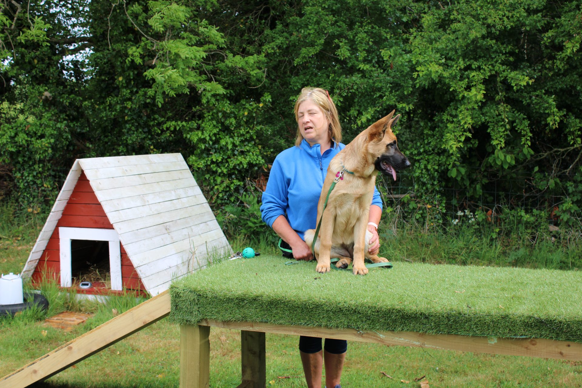 Woman with dog on platform